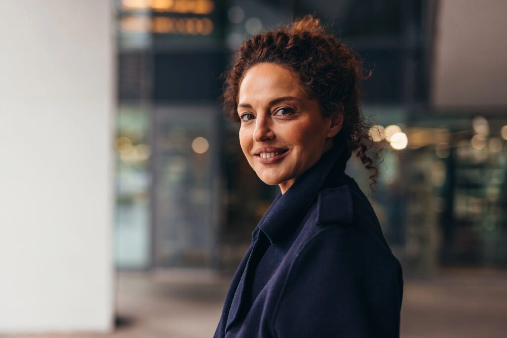 Confident businesswoman smiling in a modern office building